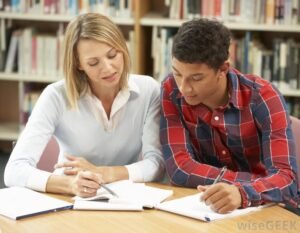 One-on-one tutoring session showing a tutor helping a student with schoolwork, representing what tutoring is.