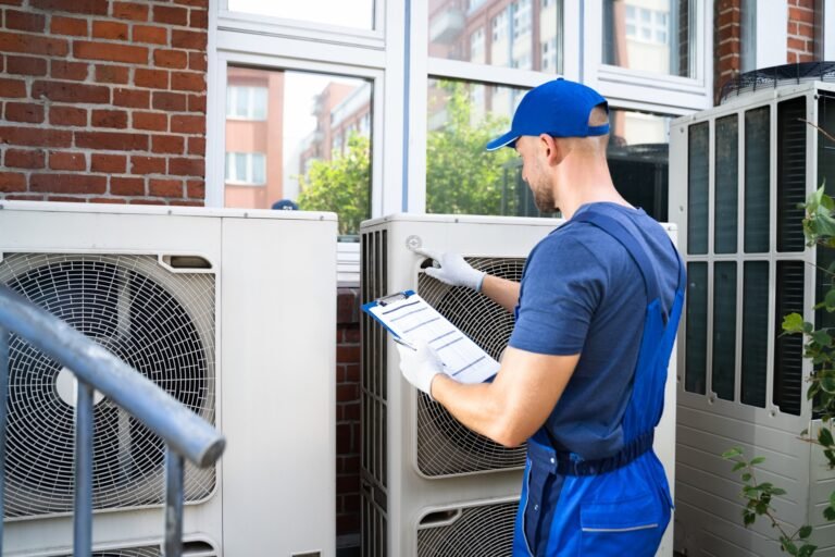 technician-inspecting-outdoor-air-conditioner-cabinet